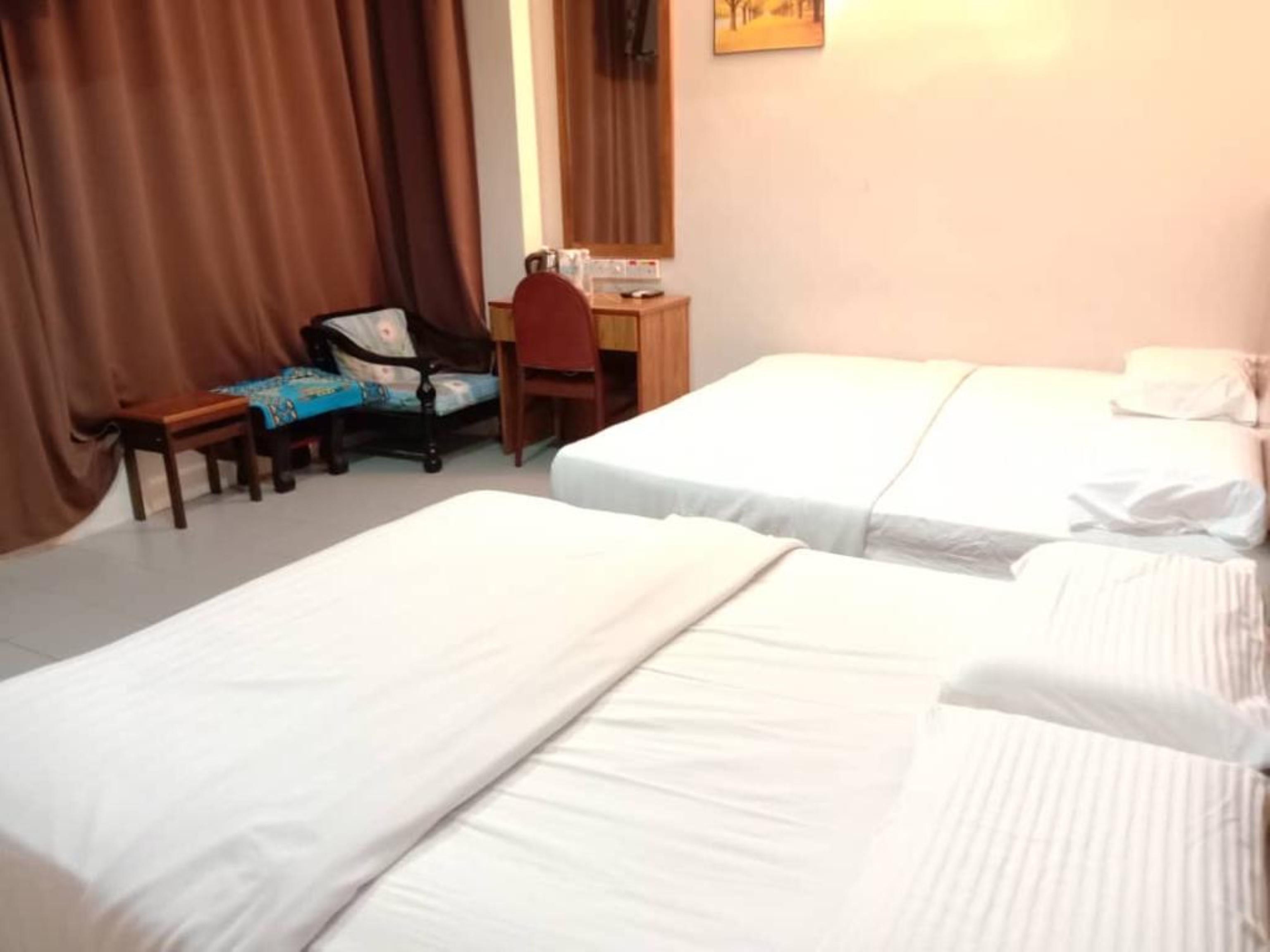 Oyo 89877 Sun Triang Hotel Kampong Kerayong Extérieur photo