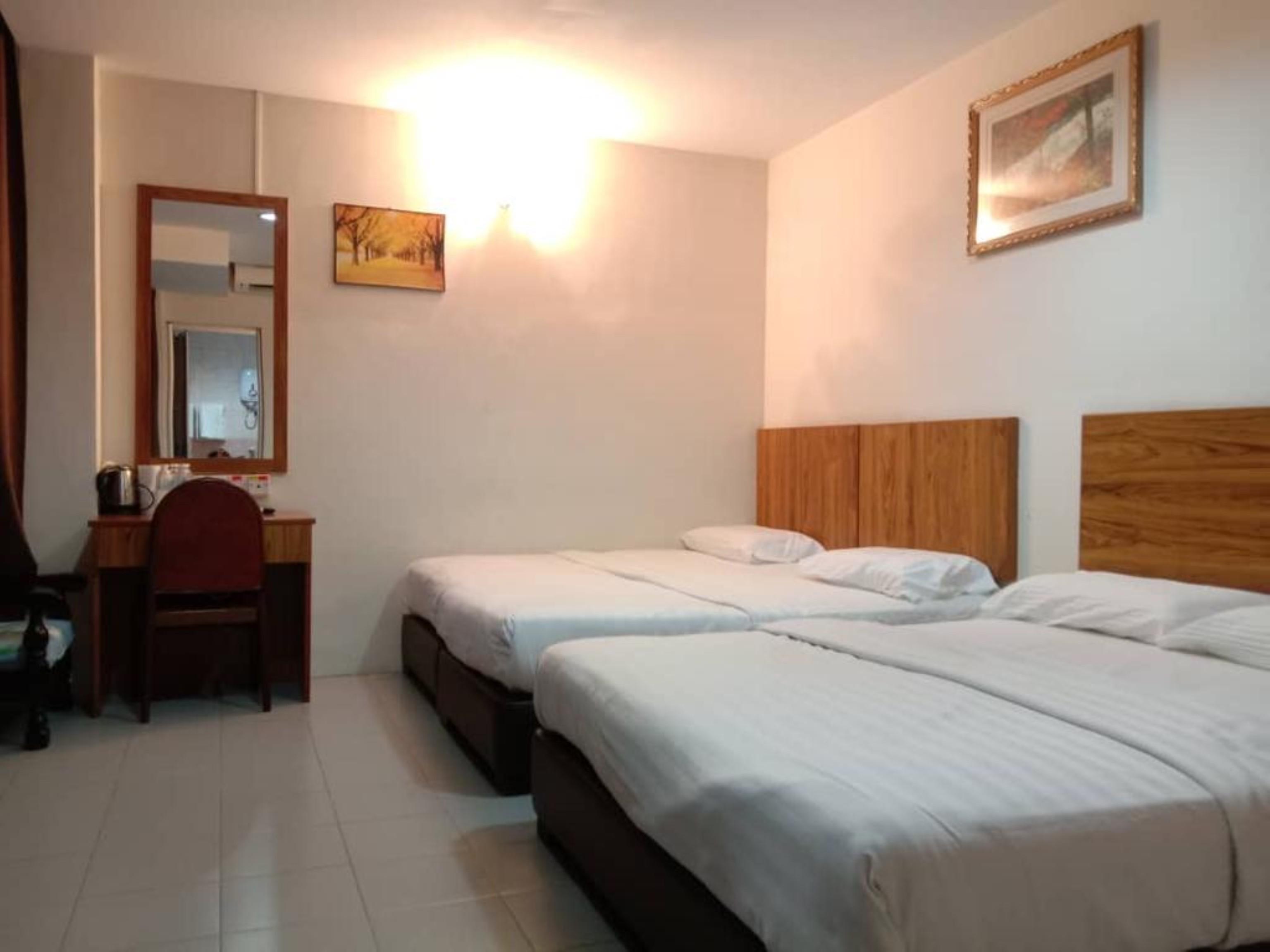 Oyo 89877 Sun Triang Hotel Kampong Kerayong Extérieur photo